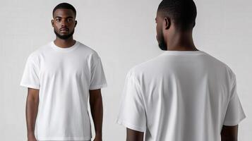Man poses in a plain white t-shirt against neutral background photo