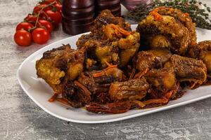 A plate of food with meat and vegetables on it photo