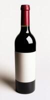 Elegant red wine bottle with blank label against white background photo