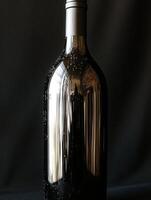 Elegant black wine bottle with shimmering bubbles displayed photo