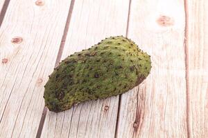 A fruit on a wooden table photo