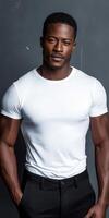 Stylish man posing in a fitted white shirt and black pants photo