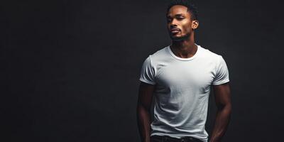 Confident man posing in casual fashion against dark backdrop photo