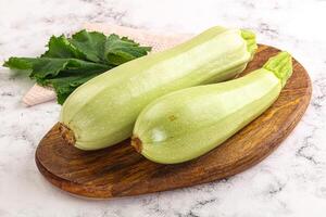 Two zucchini on a cutting board photo
