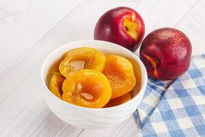 A bowl of fruit on a table photo
