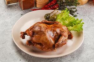 A plate of food with a chicken on it photo