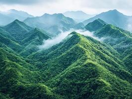 Vast green mountain landscape with mist and rolling hills photo