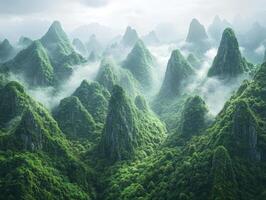 Majestic green mountains shrouded in mist at dawn photo