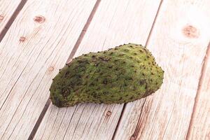 A fruit on a wooden table photo