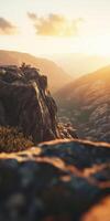 Sunset over rugged mountains with warm golden hues photo