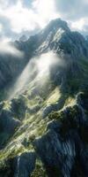 Mountain landscape with sunlight streaming through clouds photo