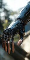 Cyborg hand with intricate mechanical design in natural light photo