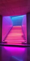 Vibrant stairs illuminated by colorful LED lights at night photo