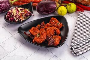 A table with some food on it and some vegetables photo