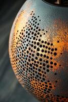 Decorative metal lamp with intricate perforated design photo