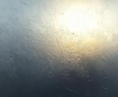 Light filtering through a foggy window at dawn photo