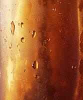 Refreshing golden beverage with condensation in summer heat photo