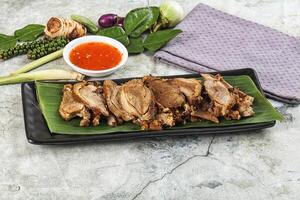 A plate with meat and vegetables on it photo