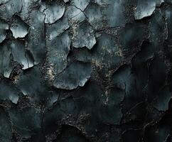 Cracked black surface with peeling paint and texture photo