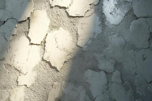 Textured wall with light and shadows highlighting details photo