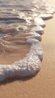 A wave is coming in to the shore photo