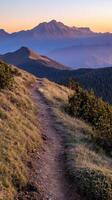 A trail on the side of a mountain photo