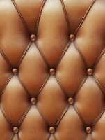 Soft brown tufted leather upholstery with decorative buttons photo