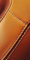 Detailed view of a rich leather texture with stitching photo