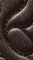 Textured leather pattern with intricate stitching design photo