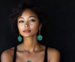 Beautiful woman posing with elegant earrings in a studio setting photo