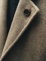 A close up of a button on a coat photo
