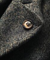 Textured fabric with a button detail on a stylish jacket photo