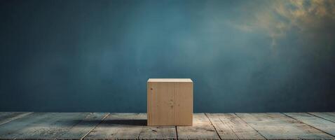 A wooden block on a wooden table in front of a blue wall photo