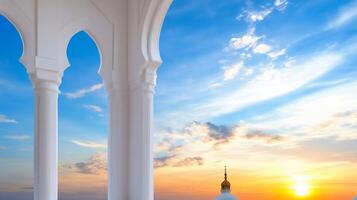 A serene sunset view through architectural arches, highlighting a dome. photo