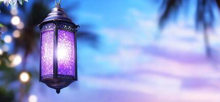 A decorative lantern illuminated against a colorful sky backdrop. photo