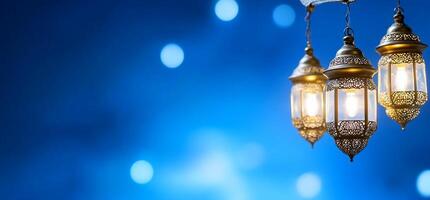 Three ornate lanterns illuminate a blue background, creating a serene ambiance. photo