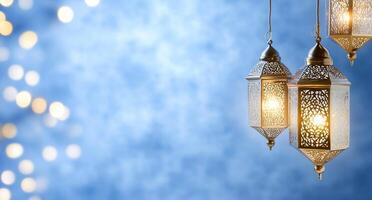Elegant lanterns illuminate a soft blue background with bokeh lights. photo