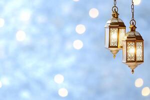 Two ornate lanterns hanging against a softly blurred background. photo