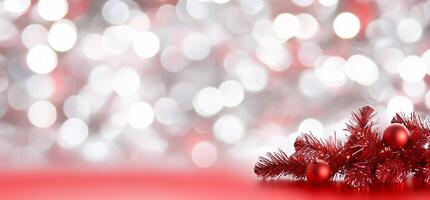 A festive background with red and silver bokeh and Christmas decorations. photo