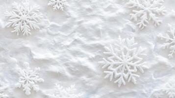 A textured white background with decorative snowflakes scattered. photo