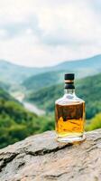 Whiskey bottle on mountain peak, scenic valley view, relaxing nature photo