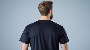 Back view of a man in a black t - shirt mockup photo