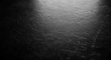 Black and white photo of a black surface