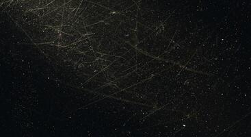 A black and gold background with stars photo