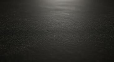 Black background with a light shining on it photo