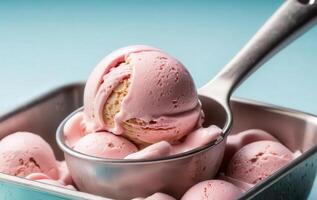 A scoop of ice cream with pink ice cream in a metal bowl photo