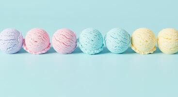 Colorful ice cream scoops on a blue background photo