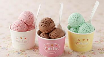 Three cups of ice cream with spoons in them photo