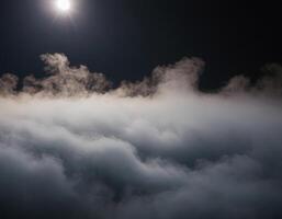 A plane flying over the clouds at night photo