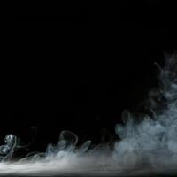 A black background with smoke coming out of a pipe photo